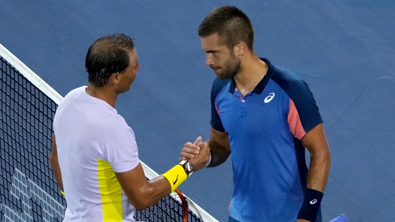 Nadal and Ćorić shake hands after their match in Cincinnati. 