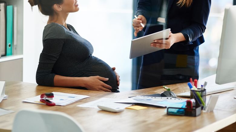 Pregnant woman office STOCK