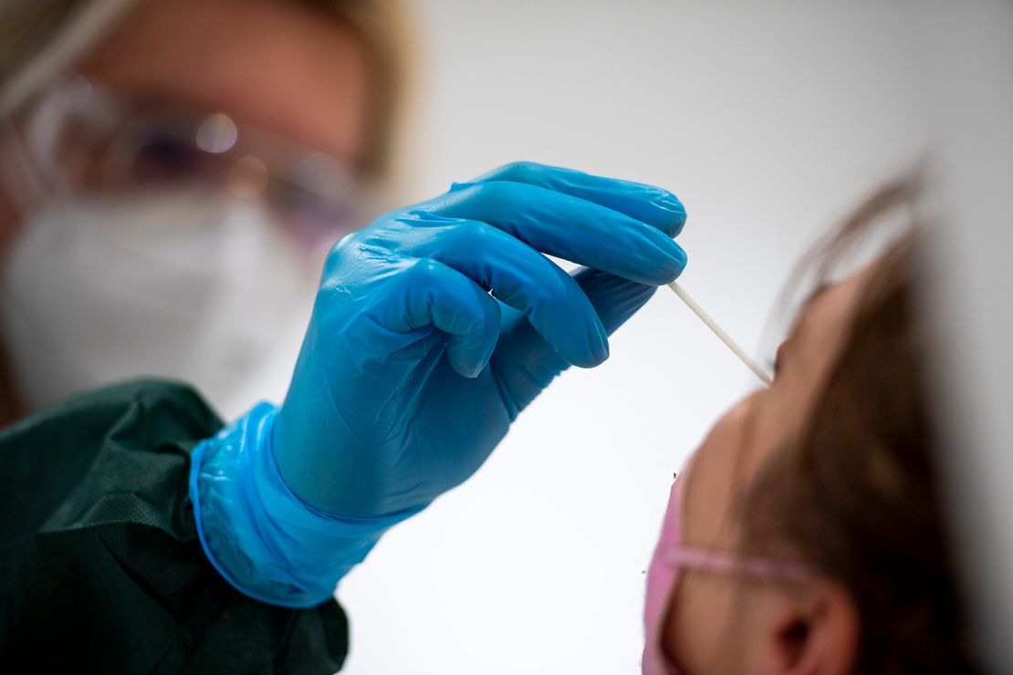 A woman gets tested for the coronavirus in June in Berlin. 