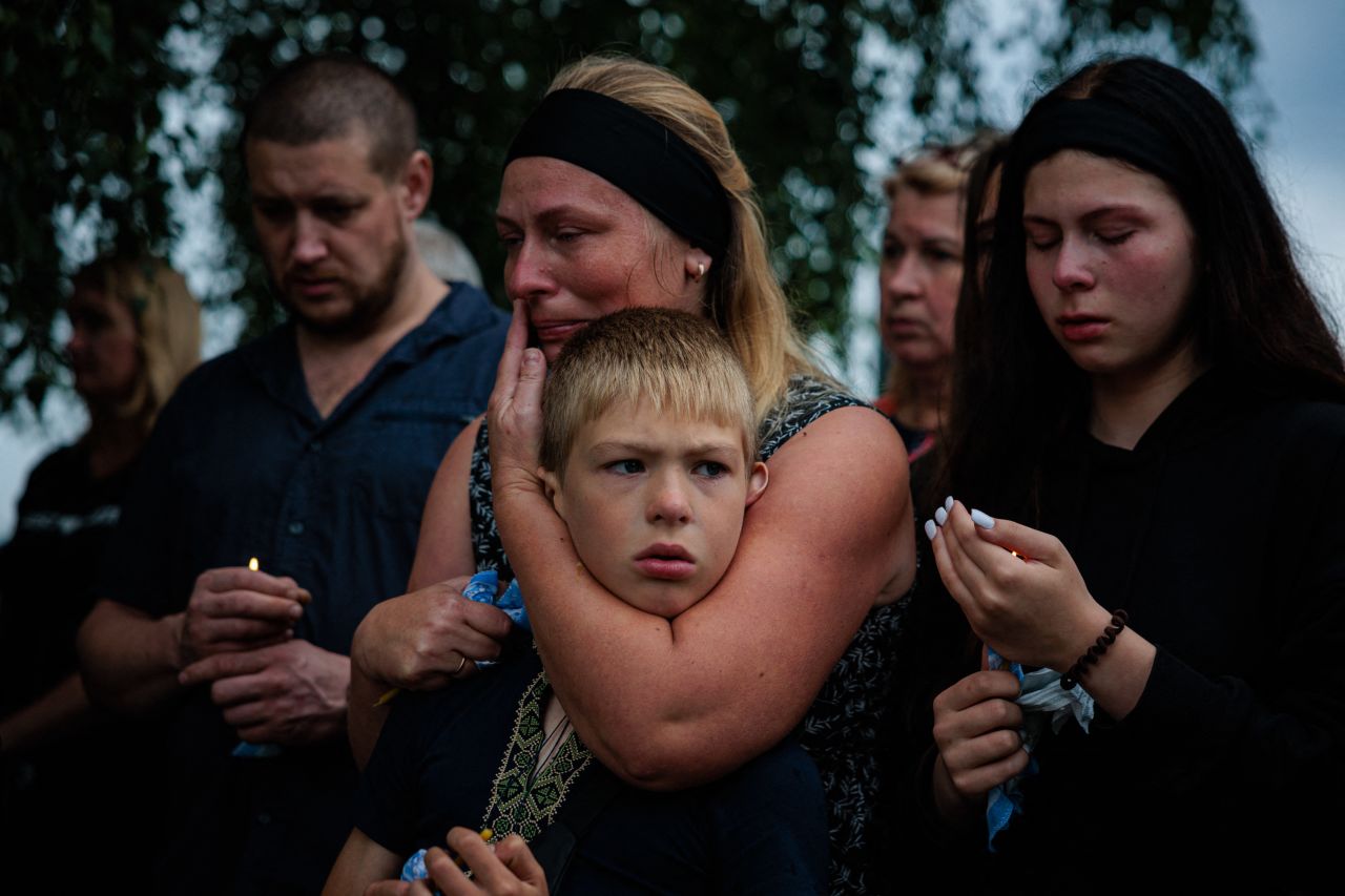 Family members mourn during a funeral ceremony for Ukrainian serviceman Anton Savystski near Kyiv, Ukraine, on Saturday, August 13.