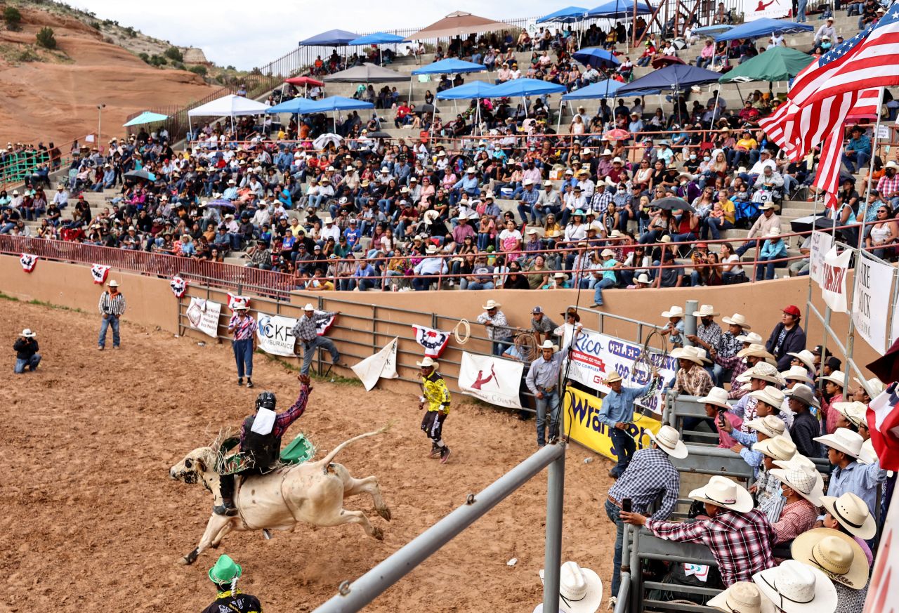 A bull rider competes at the 100th annual Gallup Inter-Tribal Indian Ceremonial Association Rodeo at Red Rock Park near Gallup, New Mexico, on Sunday, August 14.