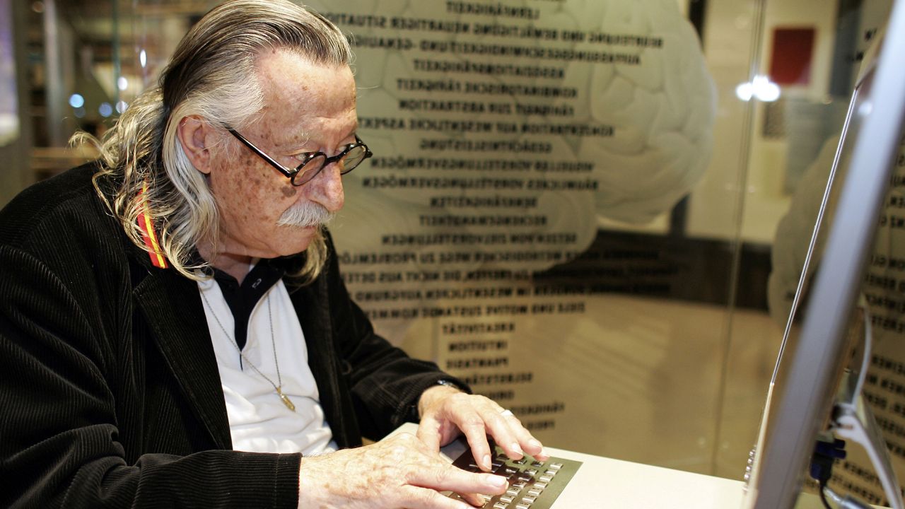 Joseph Weizenbaum, the inventor of Eliza, sits at a computer desktop in the computer museum of Paderborn, Germany, in May 2005.