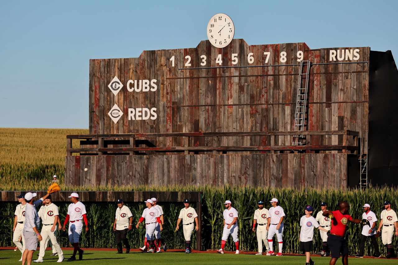Players from the Chicago Cubs and Cincinnati Reds take the field before the annual Field of Dreams Major League Baseball game in Dyersville, Iowa, on Thursday, August 11.