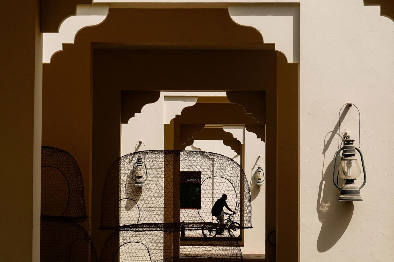 A person rides a bicycle in Dubai on Tuesday, August 16.