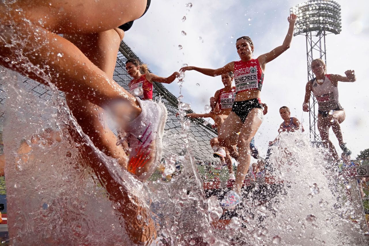 Athletes compete during a heat of the women's 3,000-meter steeplechase at the European Championships in Munich, Germany, on Thursday, August 18.