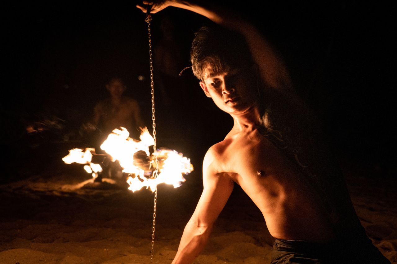 A performer dances with fire at a beach in Khao Lak, Thailand, on Saturday, August 13.