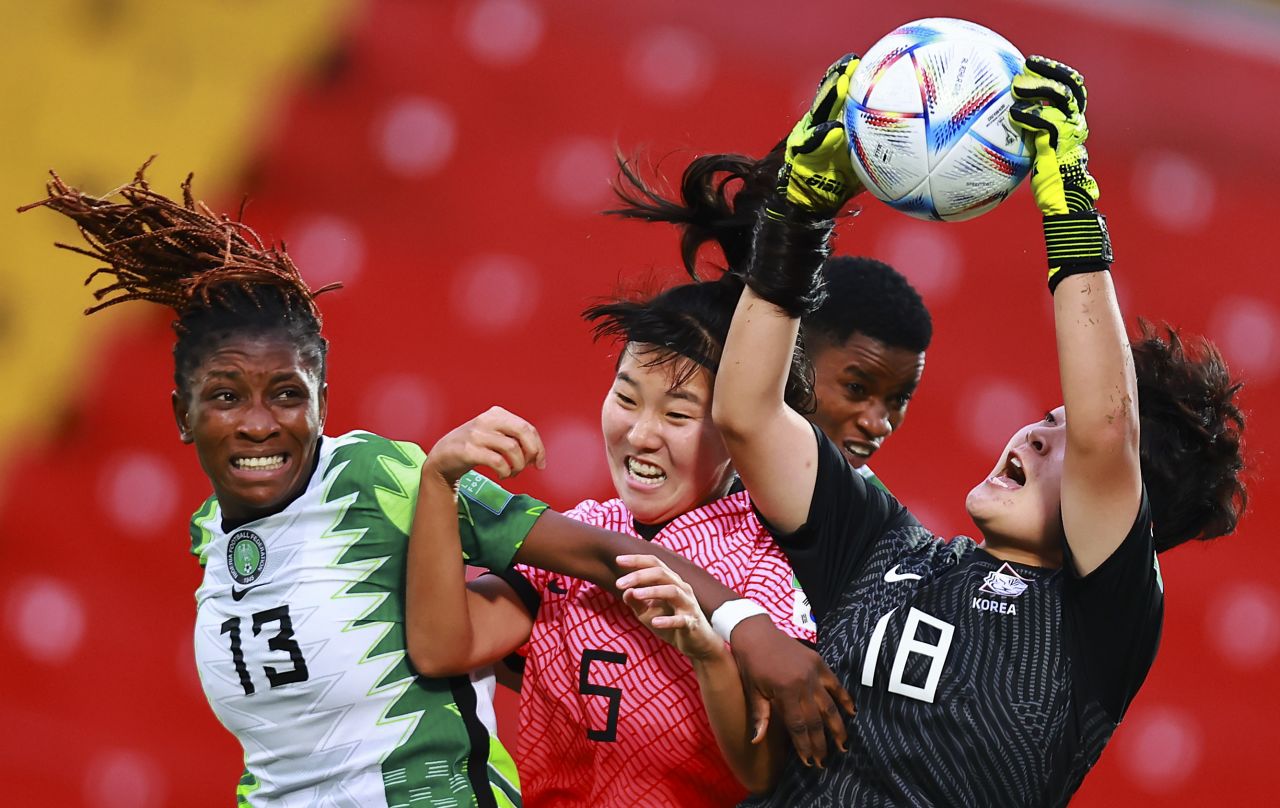 Goalkeeper Kyeonghee Kim and Suin Lee of South Korea fight for the ball with Mercy Idoko of Nigeria during their 2022 FIFA U-20 Women's World Cup match in Alajuela, Costa Rica, on Sunday, August 14. Nigeria won 1-0.