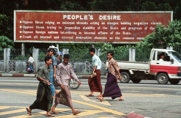 Men in Myanmar pictured wearing sarong-style skirts, known locally as 'longyi,' in the early 1990s.