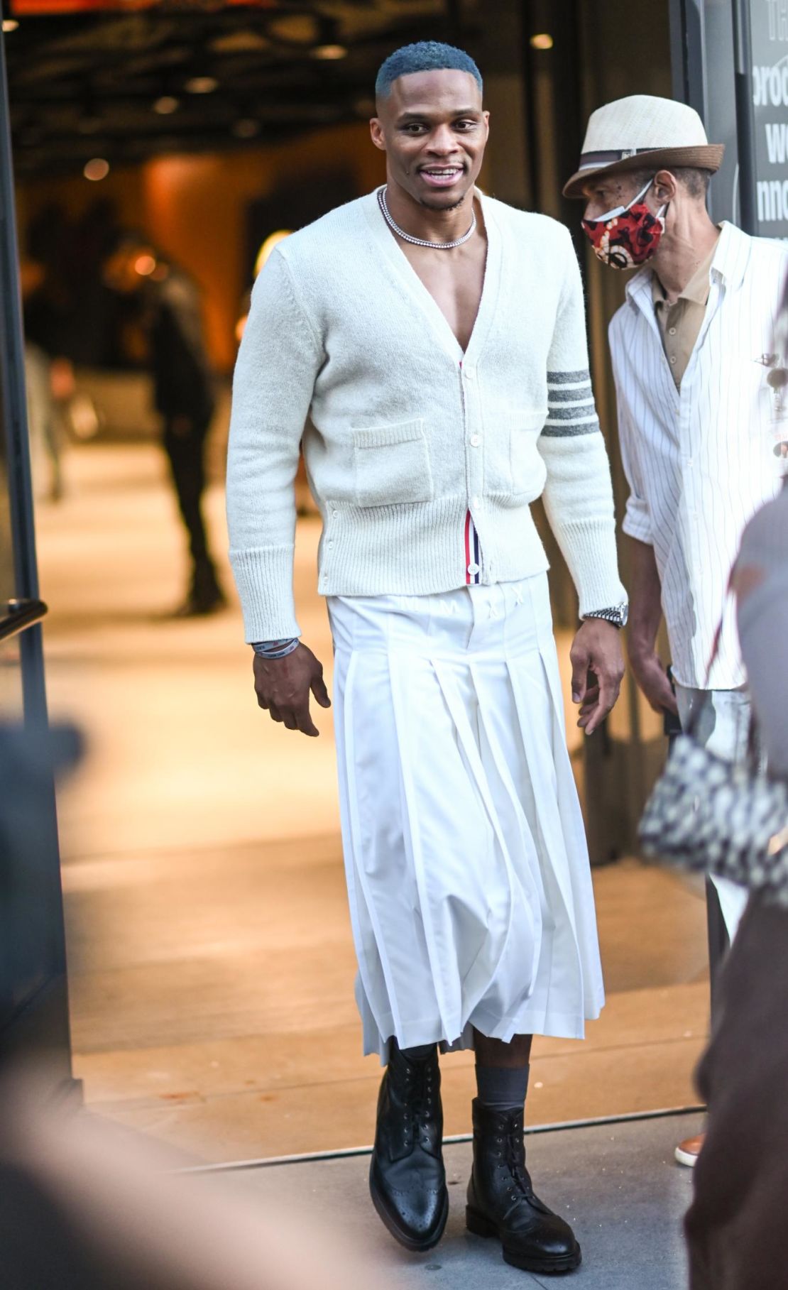 Basketball player Russell Westbrook wearing a skirt outside Thom Browne's show at the Spring-Summer 2022 edition of New York Fashion Week.