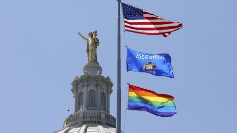 A rainbow flag observing Pride Month is displayed over the east wing of the Wisconsin State Capitol in Madison, Wisconsin, on June 7, 2019.