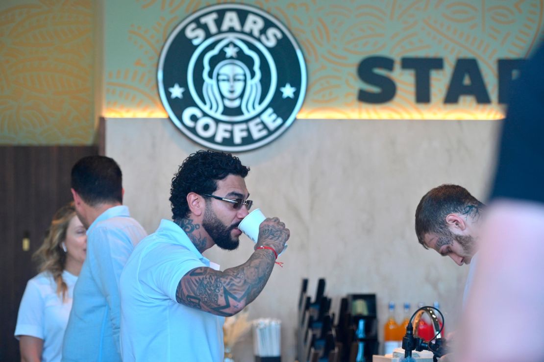 Russian singer and entrepreneur Timur Yunusov, better known as Timati, drinks coffee at a newly opened Stars Coffee coffee shop in the former location of the Starbucks coffee shop in Moscow, Russia, 