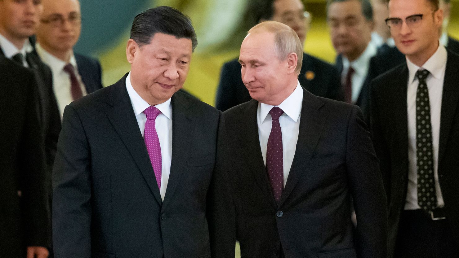 Chinese President Xi Jinping, center left, and Russian President Vladimir Putin, center right, enter a hall for talks at the Kremlin in Moscow June 5, 2019. 