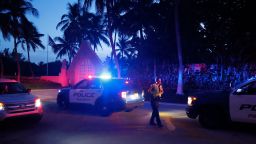 Police direct traffic outside an entrance to former President Donald Trump's Mar-a-Lago estate, Monday, Aug. 8, 2022, in Palm Beach, Fla. Trump said in a lengthy statement that the FBI was conducting a search of his Mar-a-Lago estate and asserted that agents had broken open a safe. 