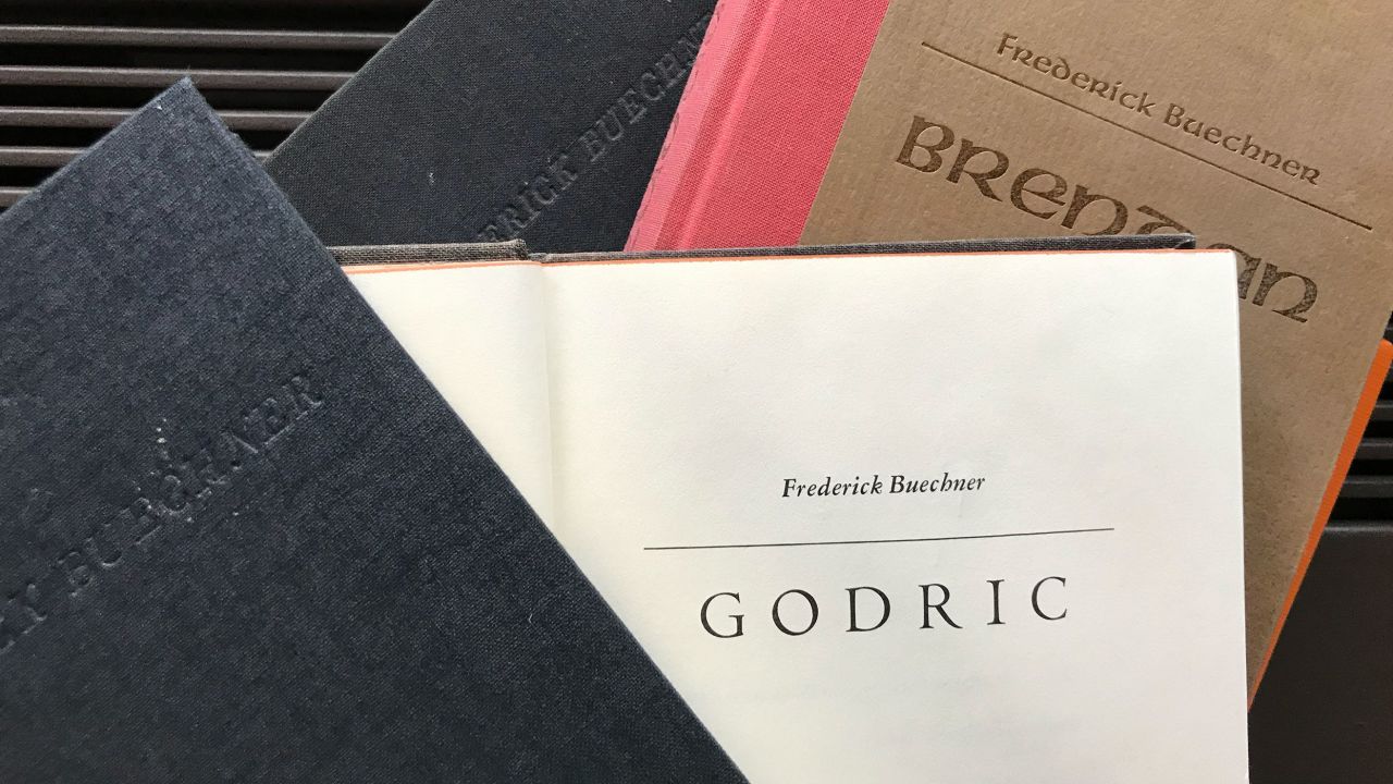 A collection of Buechner's books are seen on August 19, 2022.