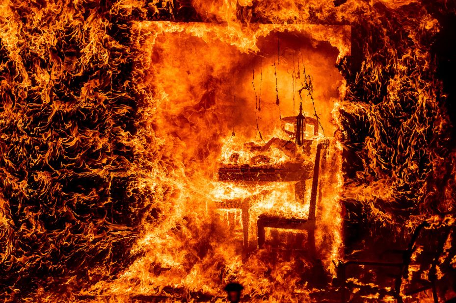 Flames engulf a chair inside a burning home in Mariposa County, California, on July 23. The <a href="https://www.cnn.com/2022/07/27/us/gallery/oak-fire-california/index.html" target="_blank">Oak Fire,</a> which started near Yosemite National Park, burned nearly 20,000 acres and is California's <a href="https://www.cnn.com/2022/07/26/us/california-oak-fire-yosemite-mariposa-county-tuesday/index.html" target="_blank">biggest wildfire</a> of the year. The challenging terrain and abundant dry vegetation fueling the wildfire complicated efforts to tamp down its growth, a Cal Fire spokesperson told CNN.