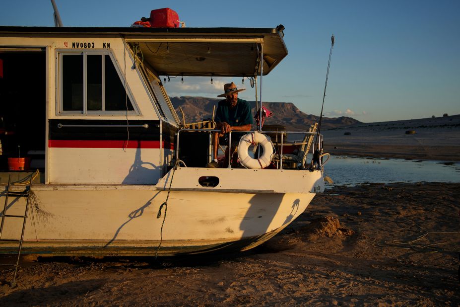 Craig Miller sits in his stranded houseboat at Lake Mead near Boulder City, Nevada, on June 23. Miller had been living on the stranded boat for over two weeks after engine trouble and falling lake levels left the boat above the water level.