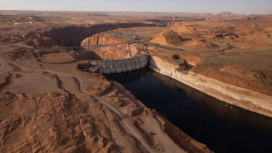 An aerial view of Lake Powell and the Glen Canyon Dam in Page, Arizona, on April 20. The Department of the Interior said on August 16 it is prepared to<a href="https://www.cnn.com/us/live-news/lake-mead-colorado-river-report/h_fbe5949c463a6e7e255e321f36de757e" target="_blank"> take action to limit the water releases</a> from Lake Powell to prevent it from plunging below 3,525 feet above sea level by the end of 2023. Below that level, the Glen Canyon Dam, which forms the reservoir, cannot produce hydropower. 