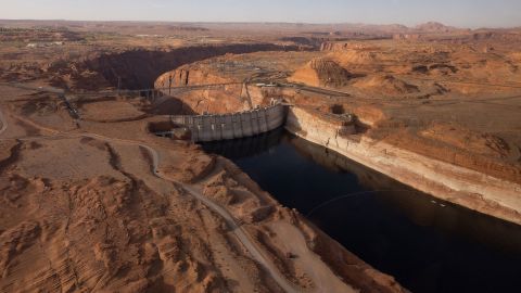 An aerial view of Lake Powell and the Glen Canyon Dam in Page, Arizona, on April 20. The Department of the Interior said on August 16 it is prepared to<a href="https://www.cnn.com/us/live-news/lake-mead-colorado-river-report/h_fbe5949c463a6e7e255e321f36de757e" target="_blank"> take action to limit the water releases</a> from Lake Powell to prevent it from plunging below 3,525 feet above sea level by the end of 2023. Below that level, the Glen Canyon Dam, which forms the reservoir, cannot produce hydropower.