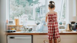 Doing chores such as washing the dishes help kids gain independence and contribute to their family's well-being.