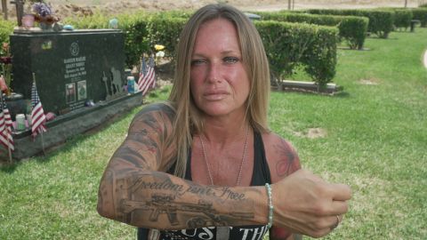 Shana Chappelle shows the tattoos with which she honors her son and others killed in Kabul.