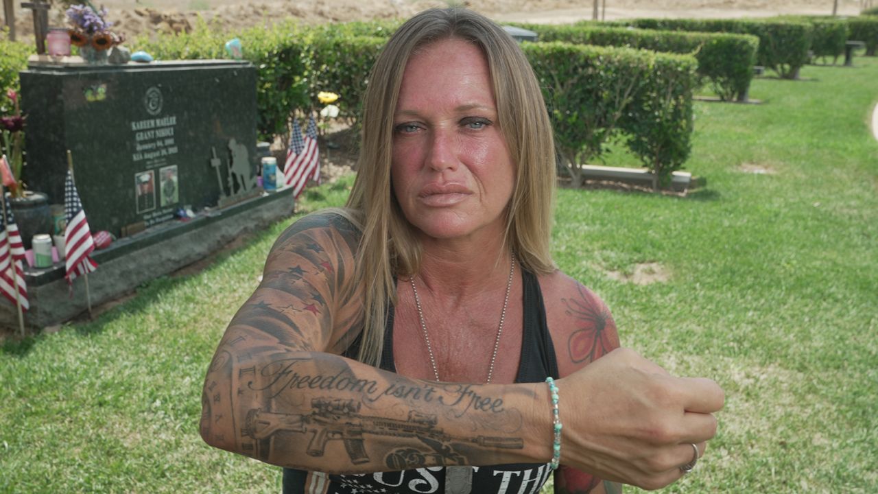 Shana Chappell shows the tattoos with which she honors her son and the others killed iin Kabul.
