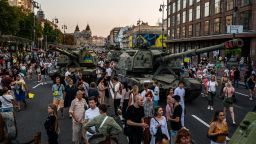 In this photograph taken on August 21, 2022, people look at destroyed Russian military equipment at Khreshchatyk street in Kyiv, that has been turned into an open-air military museum ahead of Ukraine's Independence Day on August 24, amid Russia's invasion of Ukraine.