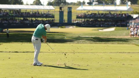 McIlroy plays his shot from the 15th tee in the third round.