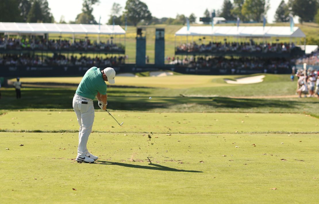 McIlroy plays his shot from the 15th tee during the third round.
