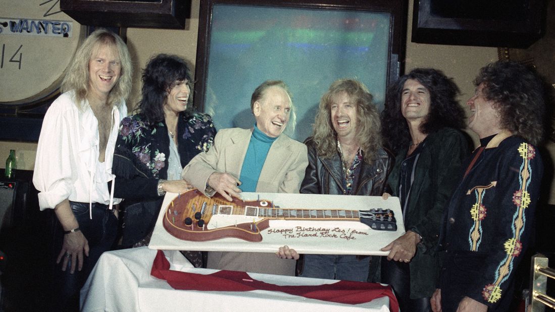 <strong>Rocking parties: </strong>Aerosmith presented guitar-making pioneer Les Paul with a guitar-shaped birthday cake at Hard Rock NYC.