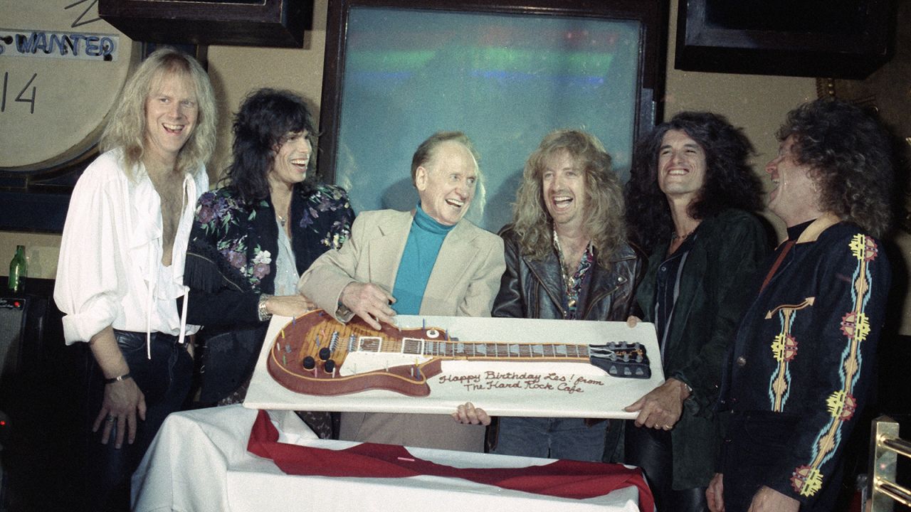 <strong>Rocking parties: </strong>Aerosmith presented guitar-making pioneer Les Paul with a guitar-shaped birthday cake at Hard Rock NYC.