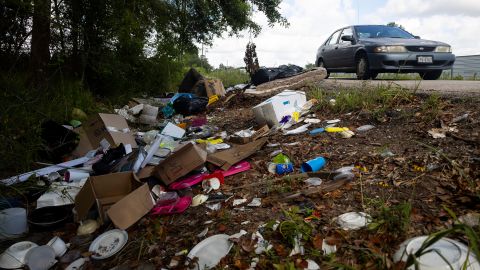 Trash fills the ditch outside of Raymond Dugas' property in northeast of downtown Houston.
