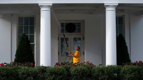 A maintenance worker power washes the West Wing of the White House on August 7, 2022, in Washington, DC.