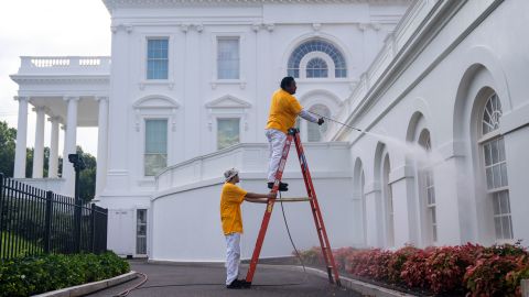 Maintenance workers power wash the exterior of the White House on August 7, 2022, in Washington, DC. 