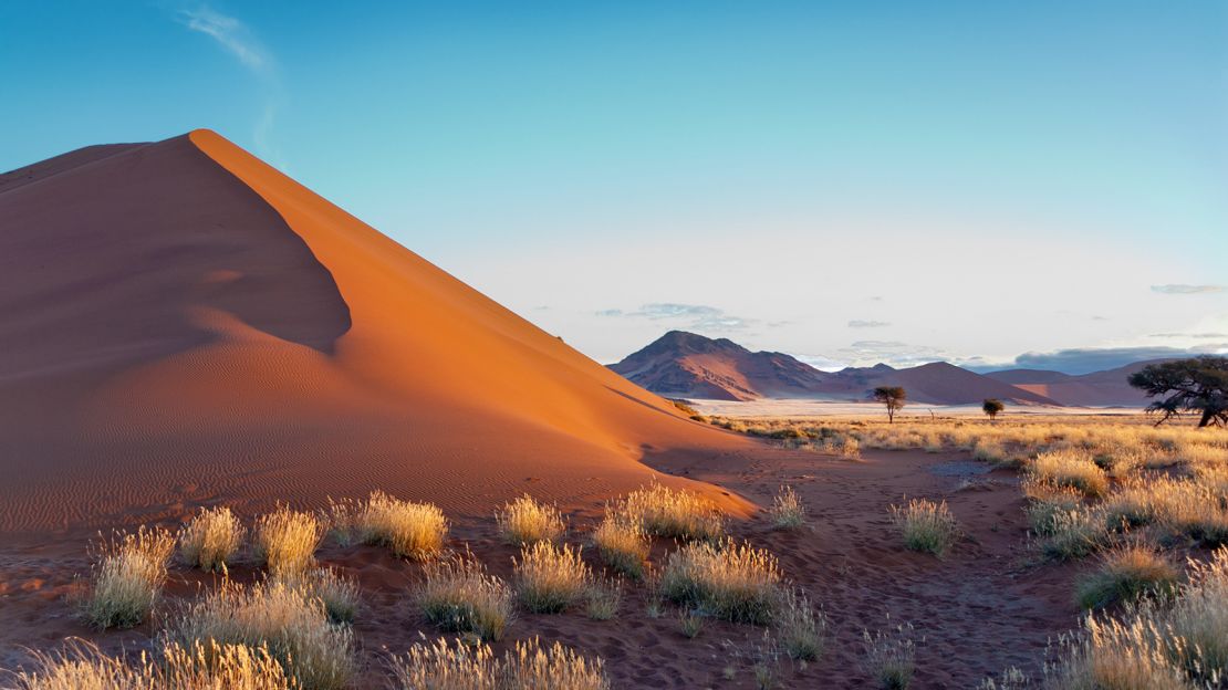 A beautiful sunset highlights the dunes of the Namib desert at Sossusvlei, Namibia. The Southwest African nation moved down to Level 2 this week.
