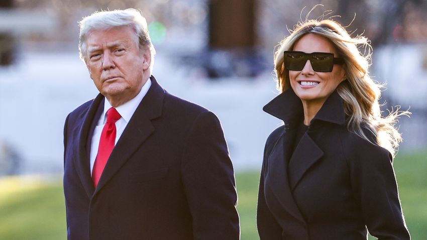 WASHINGTON, DC - DECEMBER 23: President Donald Trump and first lady Melania Trump walk on the south lawn of the White House on December 23, 2020 in Washington, DC. The Trumps are headed to Mar-a-Lago for the holidays with a government shutdown possible on Monday December 28. (Photo by Tasos Katopodis/Getty Images)
