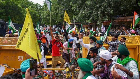 Farmers try to break through barriers during a protest called by some farm unions at Jantar Mantar on August 22, 2022 in New Delhi, India.