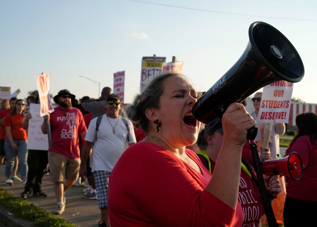 Heather Giles, a seventh-grade math teacher at Starling Elementary School, leads a chant as Columbus Education Association members picketed on August 22, 2022.