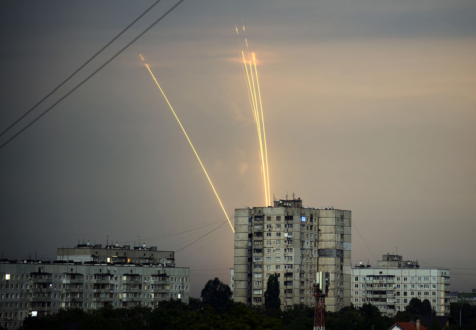 Rockets launched from the Belgorod region in Russia are seen at dawn in Kharkiv, Ukraine, on August 15.