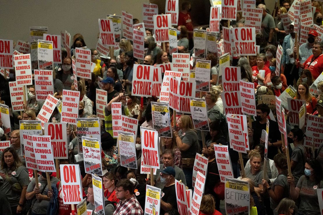 Columbus teachers' union members stream out of the convention center after voting to strike on August 21, 2022.