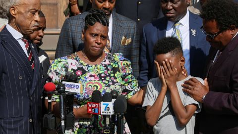 Jacob Patterson, son of the Buffalo shooting victim Heyward Patterson, is comforted by his mother, Tirzah Patterson, May 19, 2022.