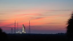 NASA's Space Launch System (SLS) rocket with the Orion spacecraft aboard is seen at sunrise atop the mobile launcher as it arrives at Launch Pad 39B, Wednesday, Aug. 17, 2022, at NASA's Kennedy Space Center in Florida. NASA's Artemis I flight test is the first integrated test of the agency's deep space exploration systems: the Orion spacecraft, SLS rocket, and supporting ground systems. Launch of the uncrewed flight test is targeted for no earlier than Aug. 29. Photo Credit: (NASA/Joel Kowsky)
