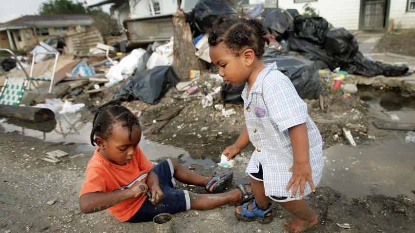 NEW ORLEANS - MAY 09: (NETHERLANDS OUT) Shanika Reaux's children Da-Vone Lewis (L), 2, and O-Neil Lewis, 1, play near their residence in the Lower Ninth Ward May 9, 2006 in New Orleans, Louisiana. Reaux's home in the Lower Ninth Ward was destroyed by Hurricane Katrina before she ever got the chance to move in last August. Reaux says she and her family moved into a donated gutted home in the Lower Ninth in February after FEMA would no longer pay for her housing once she returned to the state of Louisiana. The water is unsafe to drink in the area and many homes are completely destroyed. (Photo by Mario Tama/Getty Images)