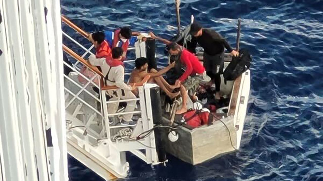 Cuban migrants board the Carnival Paradise cruise ship on Friday.