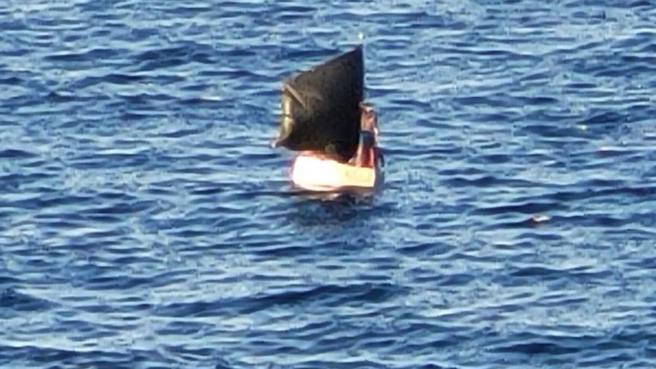 A screenshot from the video shows the migrants' makeshift raft.