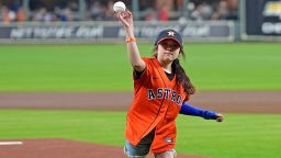 Mayah Zamora, a survivor of May's massacre in  Uvalde, Texas, throws a ceremonial first pitch Tuesday before a game between the Houston Astros and the visiting Minnesota Twins.