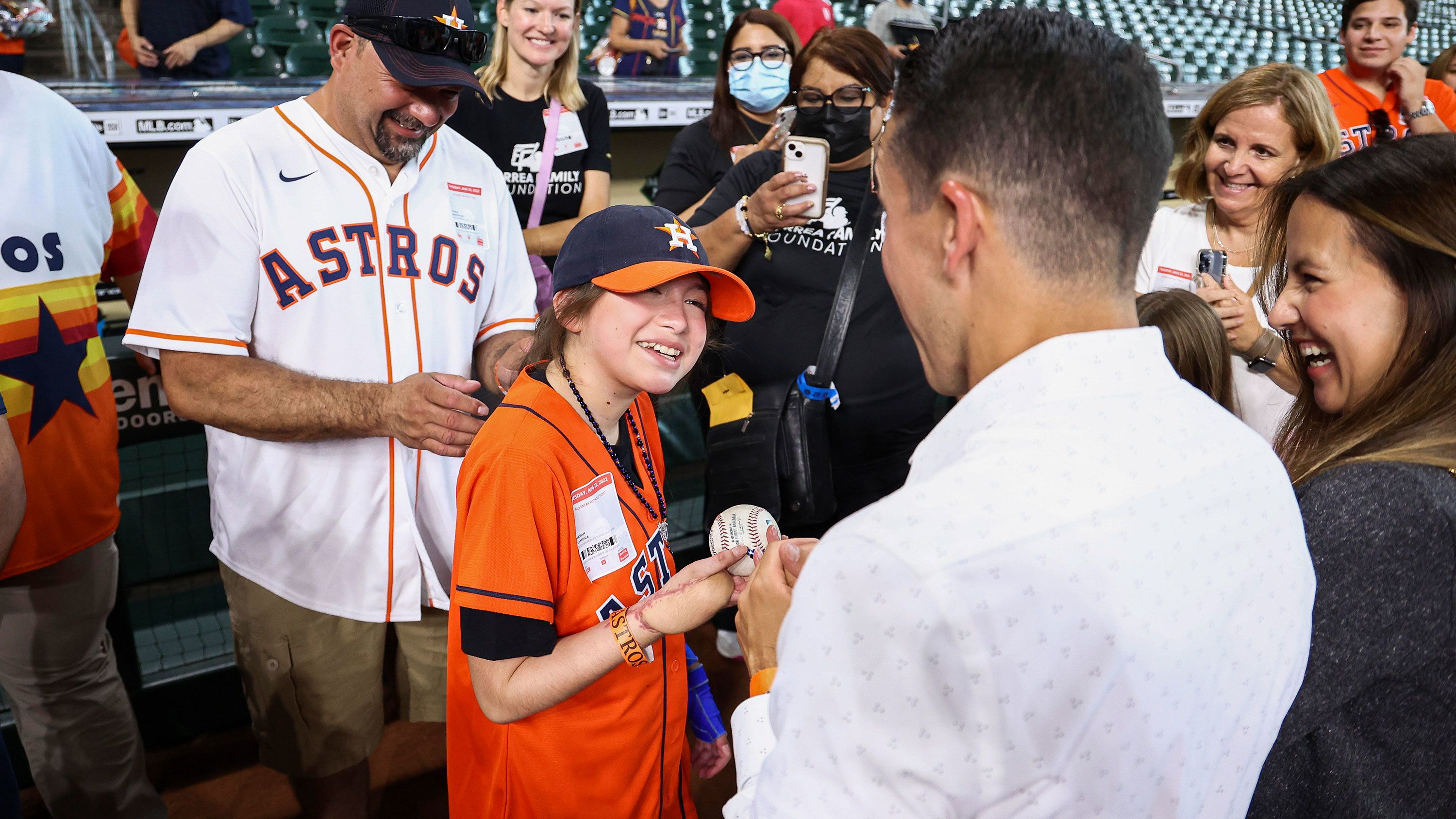 Mayah, shown at Tuesday's Astros game, endured more than 20 surgeries after the shooting in May.