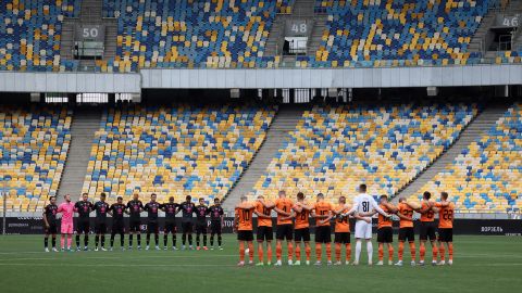 Players from Shakhtar Donetsk and FC Metalist 1925 Kharkiv observe a moment of silence for all those killed in the war as the Ukrainian Premier League restarts.