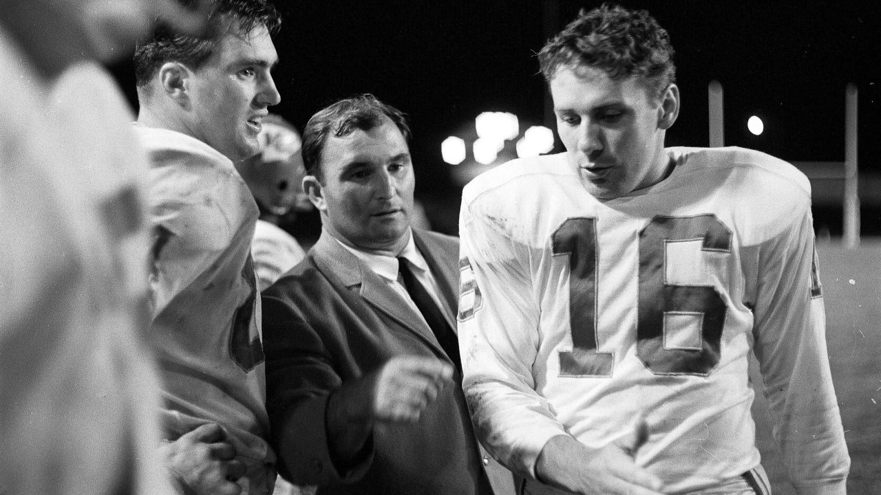 Dawson speaks with Chiefs coach Hank Stram on the sidelines during a game against the Denver Broncos.