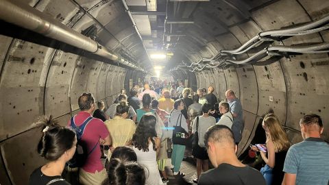 Handout photo taken with permission from the Twitter feed of Kate Scott of passengers in an emergency tunnel as Eurotunnel passengers are facing travel chaos after a train broke down down beneath the English Channel. Issue date: Tuesday August 23, 2022.