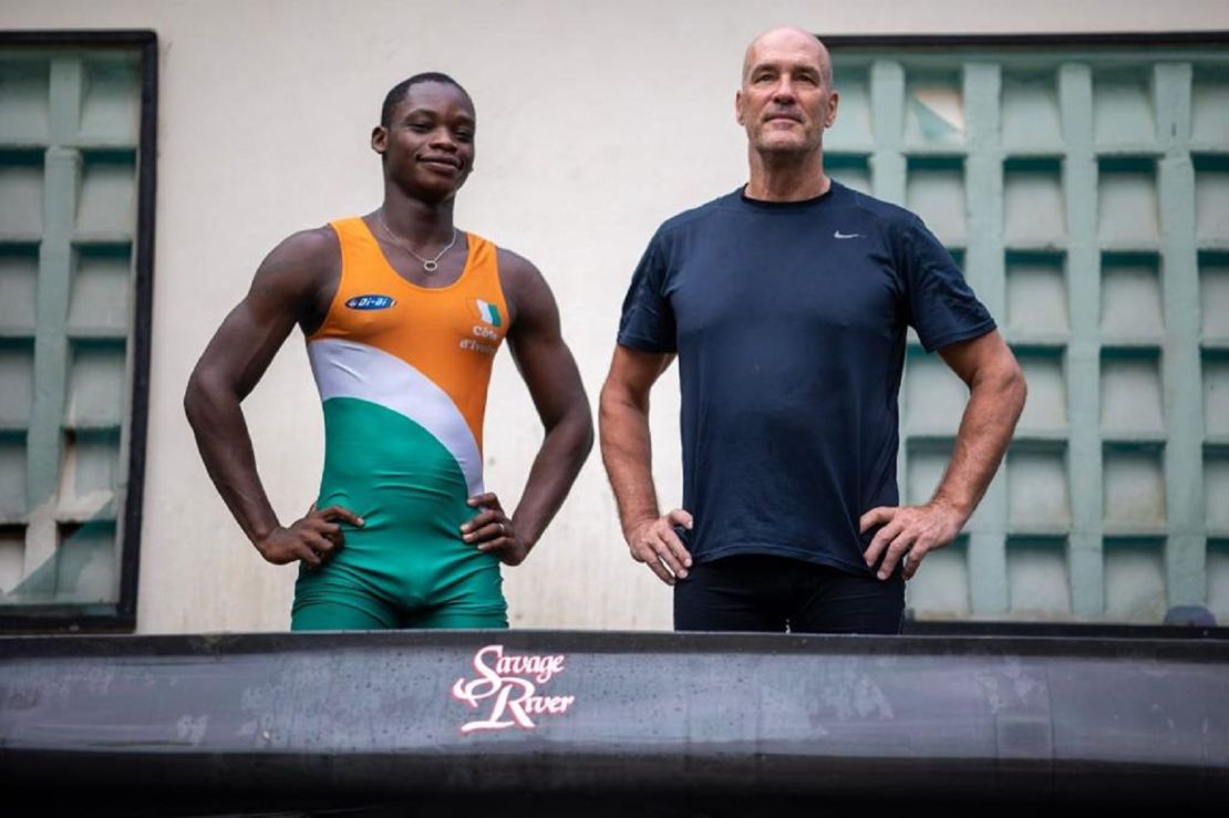 Franck N'Dri (left) stands next to his rowing coach and Canadian former Olympic rower Timothy Turner.